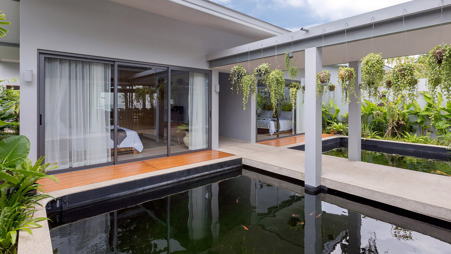 twin-villas-natai-14-twin-villas-natai-north-villa-pond-and-bedroom-5b30997b1209a